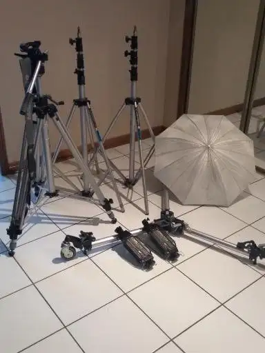 2 Lowel TOTA Lights 1 Manfrotto #181 Dolly 2 Manfrotto 004 Art Air Cushion Light Stands 1 Manfrotta...