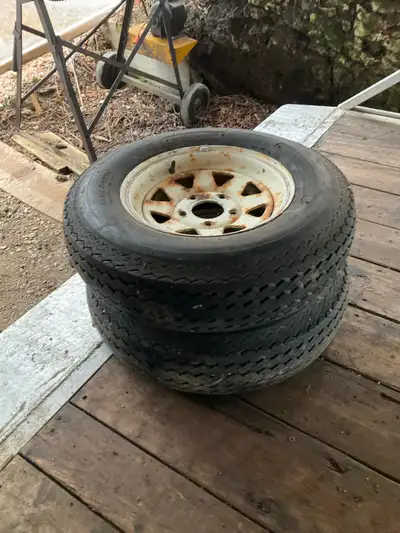 Two trailer tires, two oturn tires and one tube type, two flat free wheel barrow tire for sale. $100...