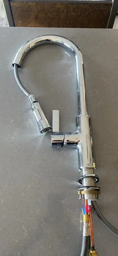 This Riobel pull-down kitchen faucet is in excellent condition and features a sleek chrome finish. I...