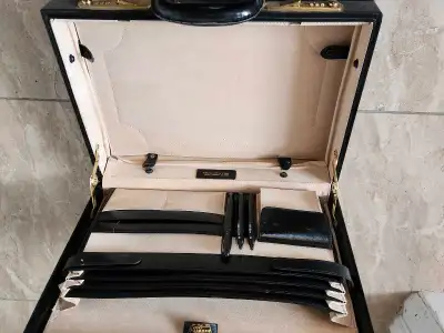 I'm selling a pre-owned Schlesinger leather briefcase with a combination lock. This stylish briefcas...