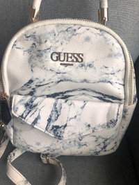 $10  ONLY- MEDIUM WHITE GUESS BACKPACK- USED SLIGHTLY 