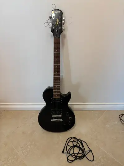 Selling pre-owned Epiphone Les Paul Special II Electric Guitar (Black solid body), along with it's g...