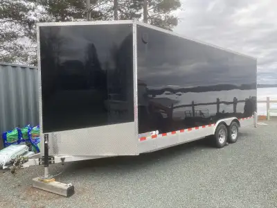 Enclosed cargo trailer with rear ramp reinforced to drive in with a car. Gap plate to allow easy loa...