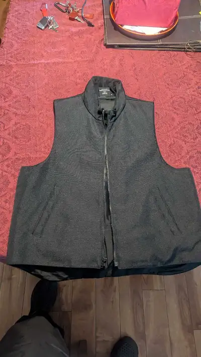 Heated vest only worn a few times. Like new size 44 or large. Paid 255