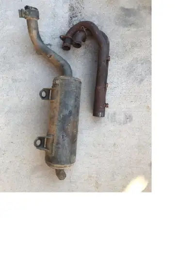 This is a used Polaris Predator ATV 500 exhaust. It is stock and complete as seen in pic. Its in goo...