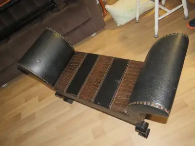 Faux leather retro looking bench seat great for entrance way or end of bed. Some small wear marks an...