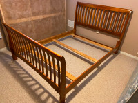 Queen size sleigh bed frame and box spring.
