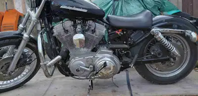 Check out this 1994 Harley-Davidson Sportster, a real head-turner with its lowrider style and custom...