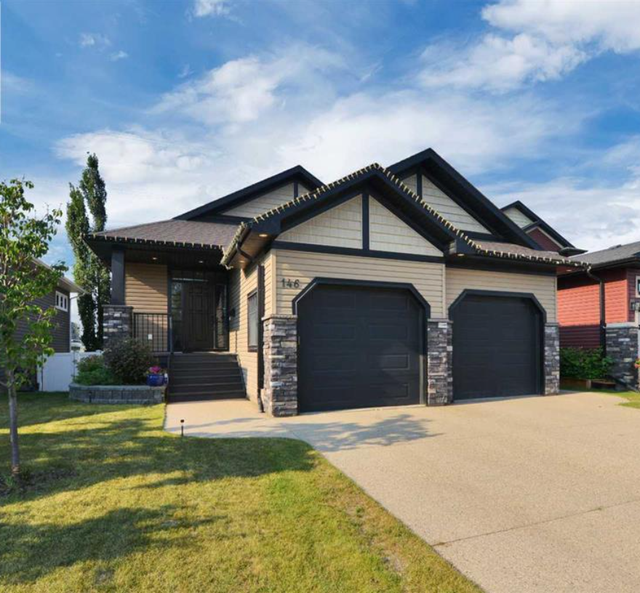$50K Price Drop! Immaculate Walk-Out Bungalow on Green Space