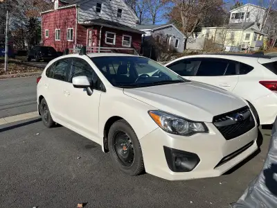 2014 Subaru Impreza • 2.0L engine, 5-speed manual • Mostly highway miles – gentle on the engine • Su...
