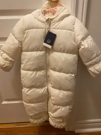 I'm selling a brand new with tag Gap baby puffer jacket one piece size 12 to 18m, looking to sell fo...