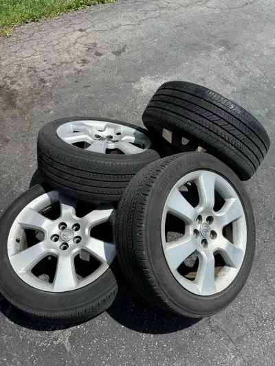 4- Bridgestone Ecopia all season 215 5017 tires Mounted on original Toyota matrix rims $500 If ad is...