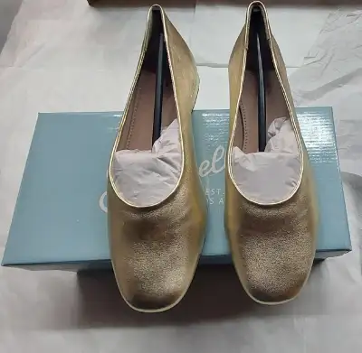 New Product Description: Ground your ensemble with a chic foundation courtesy of these metallic flat...