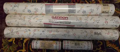 2.5 rolls of floral-pattern vinyl wall covering (self adhesive), plus 2 rolls of decorative border.