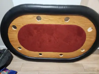 Full-size poker table in good condition. Features a large red felt playing surface, thick padded bla...