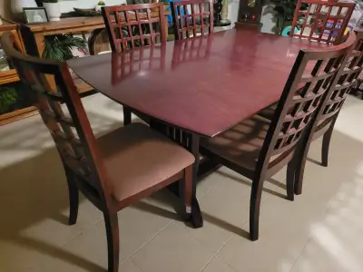 This is my family dining table with 6 matching chairs that was purchased from Mobilia in the early 2...