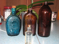 Four Vintage Bottles Selling as a Lot