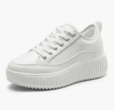 Step into comfort & style. Featuring a chic white PU finish, lace-up closure, and lightweight outsol...