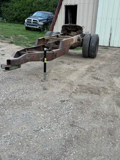 Converter dolly with 5th wheel, has 9.00-20 tires that hold air but are not great shape, new jack. B...