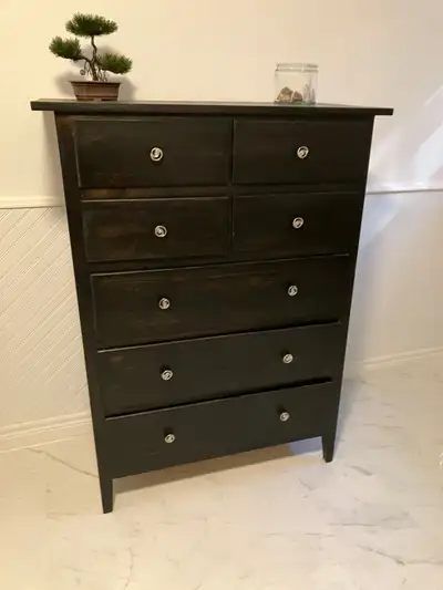 7 Drawer dresser brown/black stain. Tall. 39" wide x 52 1/2" tall x 18 1/2 " deep . The back panel t...