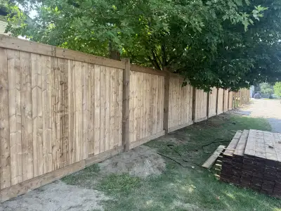 $52 a linear foot fence 6’ high fence 6x6 posts 2x6 cross members Post caps All pressure treated woo...