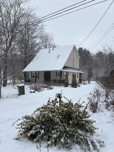 Discover this charming home, nestled amidst a serene, snow-covered landscape, offering a perfect ble...