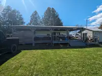 Park model Trailer with roof at Stanley Park Manitoulin Island