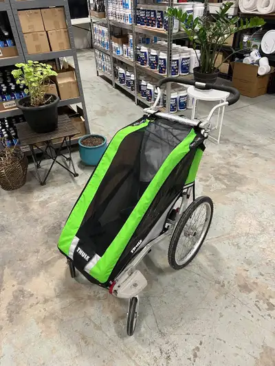 Premium Thule bike trailer that doubles as a smooth-rolling jogging stroller. Perfect for active par...