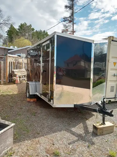 Haulin V-Nose, 6' x 12' ramp door, less than 100 miles in excellent like new condition. LED lights,...