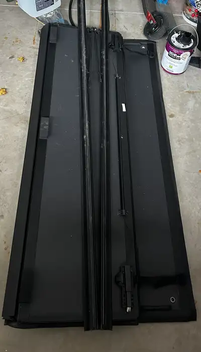 Roll-up tonneau cover used on a 2024 Chevy Silverado with extended bed. Excellent Condition. All par...