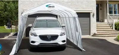 Toile d’abri d’auto Harnois grandeur 11’x20’. Elle a été utilisée deux ans.