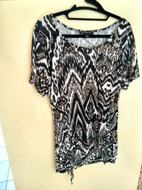TOP IN NEW CONDITION. SIZE: MED.-LARGE,WOMEN'S