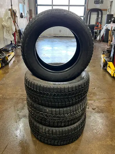 Selling set of 4 Snow tires/Lots of tread left! No patches or cracking 215/60 R16 Uniroyal TigerPaw...