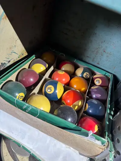 Selling a set of used pool balls, ready for a new game. These billiard balls have seen some action,...