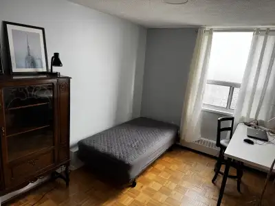 This room is available for rent and includes a bed, desk, and ample natural light. The unit is locat...