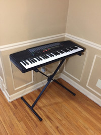 Casio digital keyboard piano with power adapter and stand