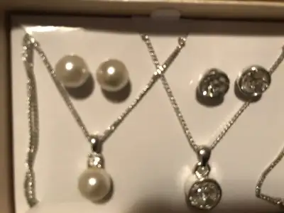 2 necklaces and 2 pierced earrings set not been worn bought for a display. Not damaged