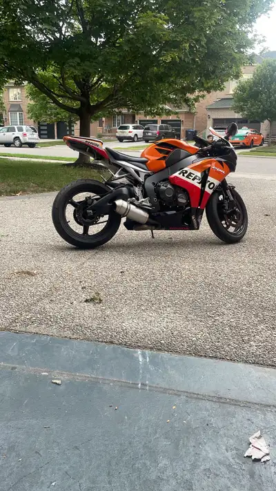 Honda CBR 1000 showcases the iconic Repsol racing livery and delivers an exhilarating ride with its...