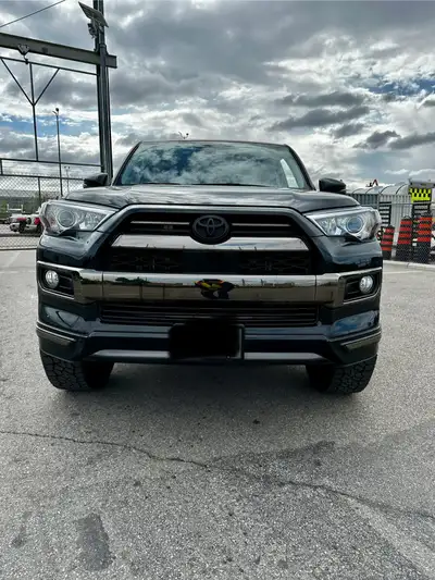 I am selling my 2020 Toyota 4Runner Nightshade Limited, a robust SUV with a sleek black exterior, al...