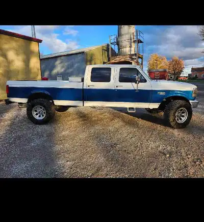1997 4x4 f350 with a 97 12 valve and zf5. Truck has rust around front and rear wheel wells. Undersid...
