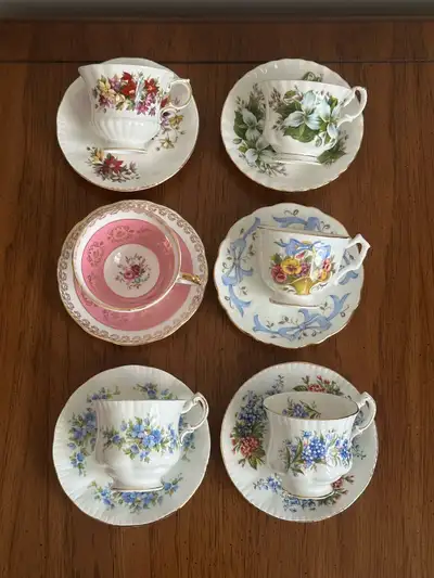 Elegant collection of vintage English bone china teacups and saucers from Paragon, Royal Albert, and...
