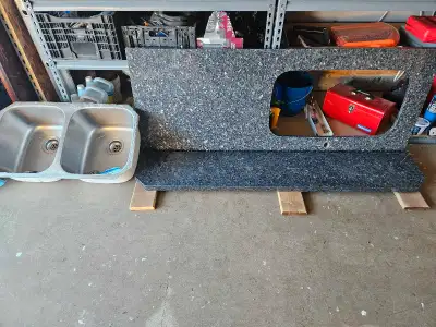 Quartz counter top in good used condition. Undermount sink included with hardware. No faucet. Measur...
