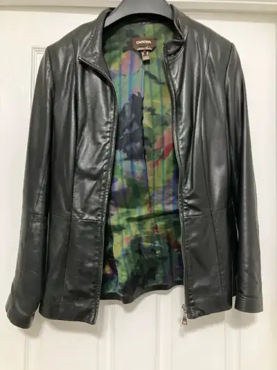 I am selling a Danier Italian Leather Jacket, size small. This sleek black jacket features a unique...