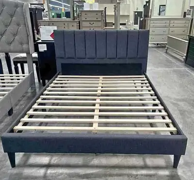 This is a brand new queen size bed frame that features a stylish and modern design, perfect for upgr...