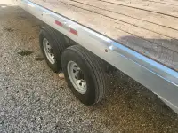 Aluminum deck over trailer twenty four and a half feet long
