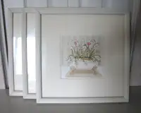 A set of three framed pictures