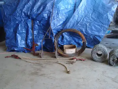 2 part rolls of Barb wire 1 rope wire stretcher 1 manual stretcher 2 pairs of wire pilers part box o...