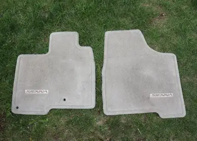 Front driver and passenger side mats, tan coloured, never used. They were for a 2005 Sienna, but I b...