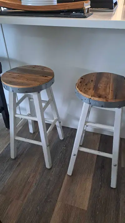 These are 2 counter height custom coastal stools featuring reclaimed wood tops and white painted bas...