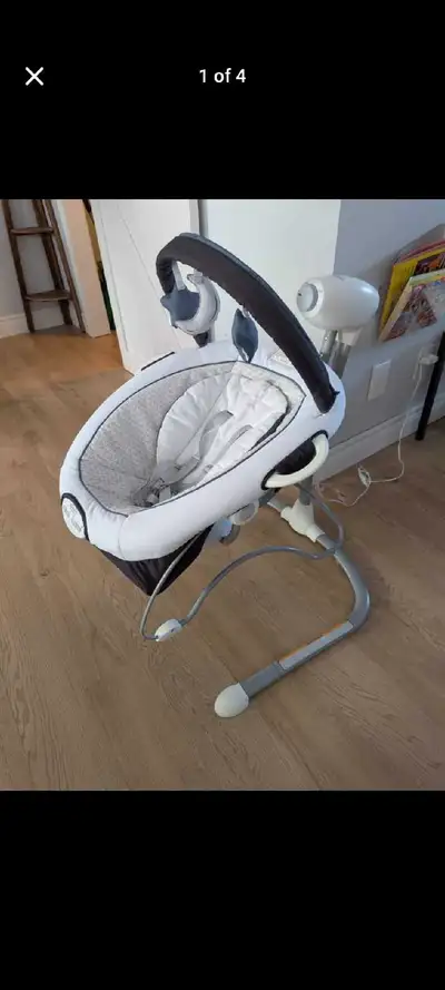 This is a used Graco baby swing in good condition, perfect for soothing your little one with its gen...
